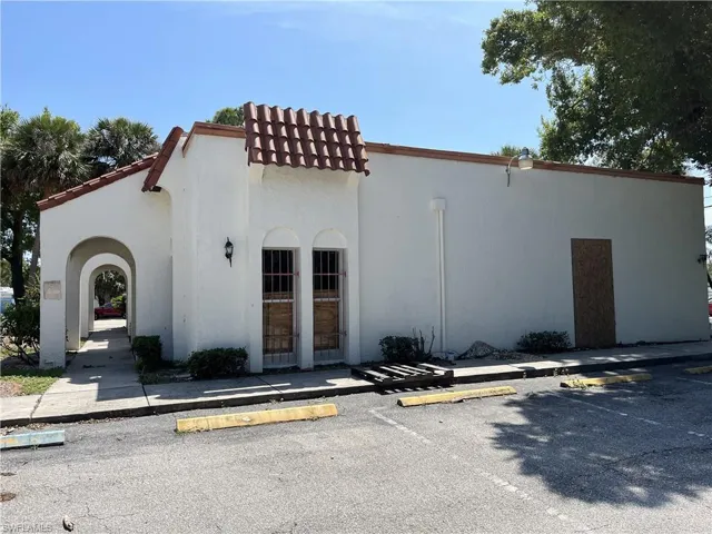 View of property with uncovered parking