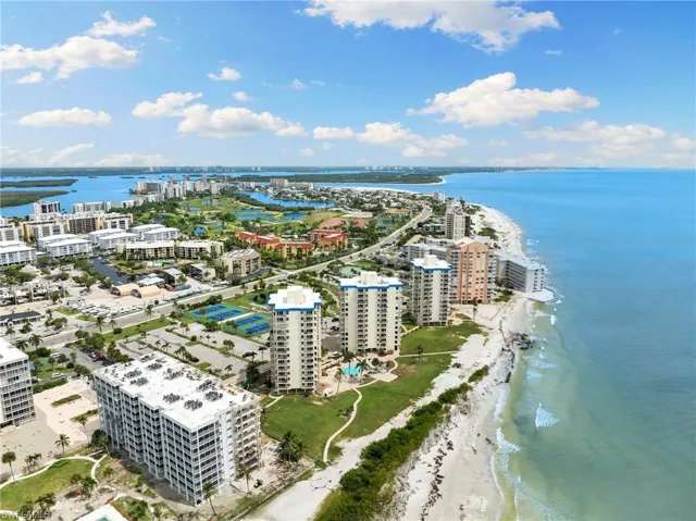 Bird's eye view with a water view and a view of the beach