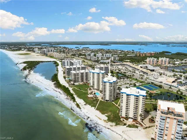 Aerial view featuring a view of the beach and a water view