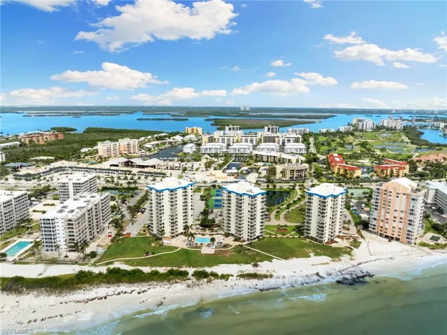 Bird's eye view featuring a beach view and a water view