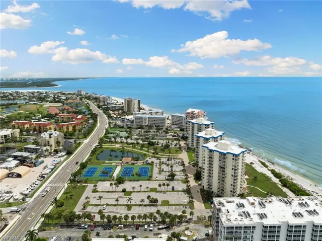 Birds eye view of property with a water view