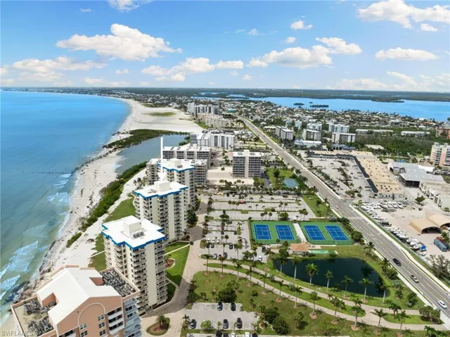 Bird's eye view featuring a beach view and a water view