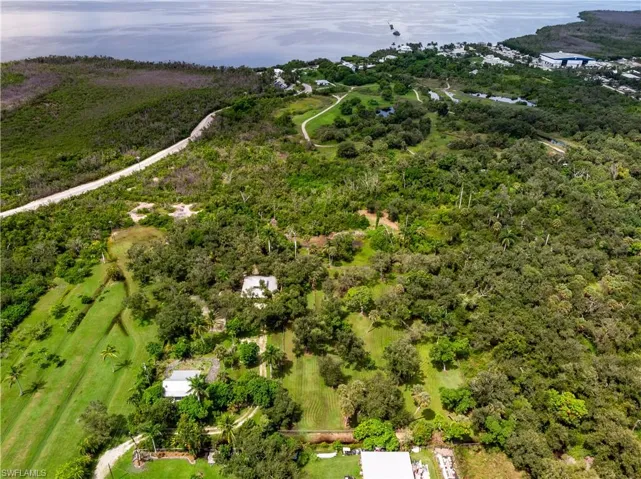 Drone / aerial view featuring a water view and a rural view