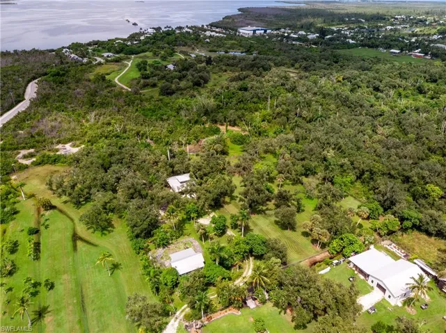 Birds eye view of property featuring a rural view