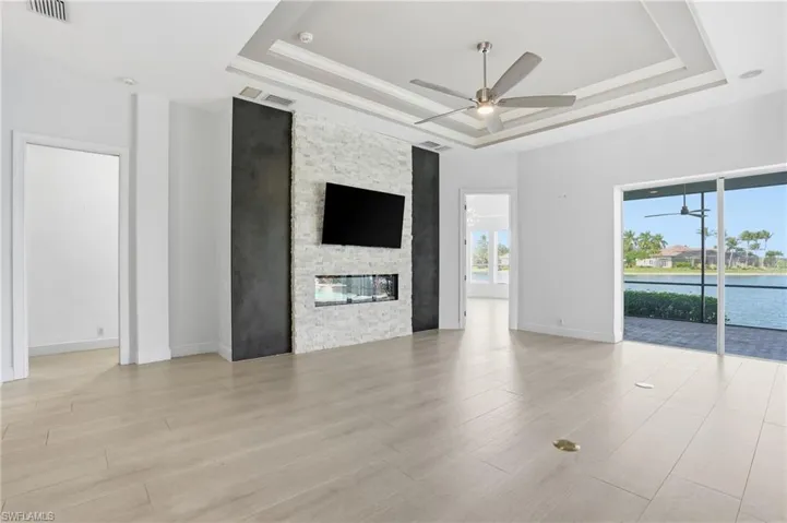 Open family room with TV wall and fireplace