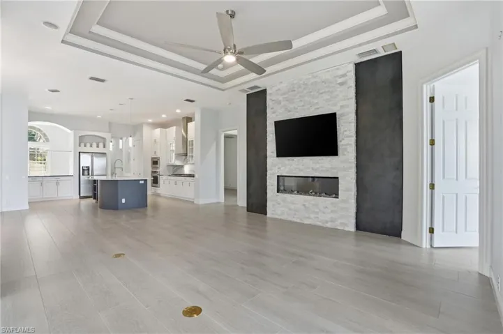 Open family room with TV wall and fireplace