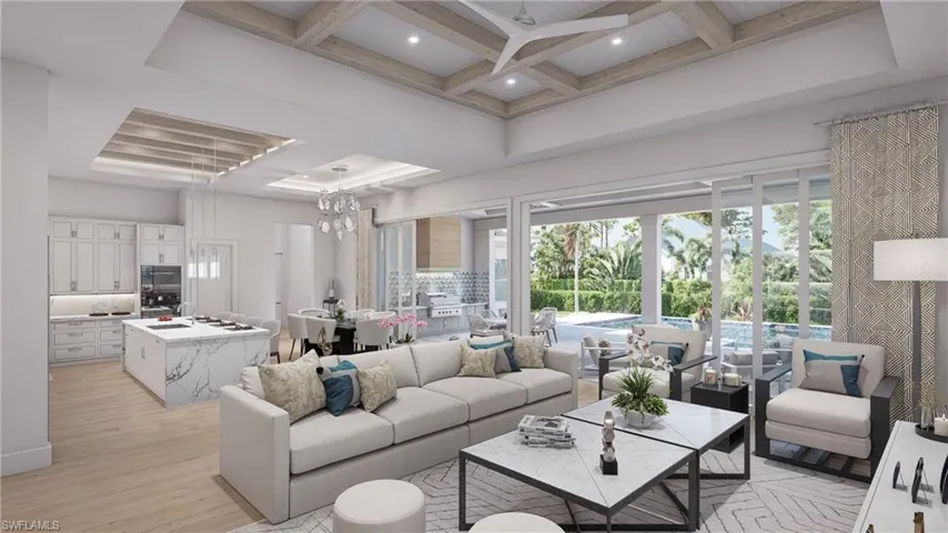 Living room featuring beamed ceiling, a high ceiling, light hardwood / wood-style floors, and coffered ceiling