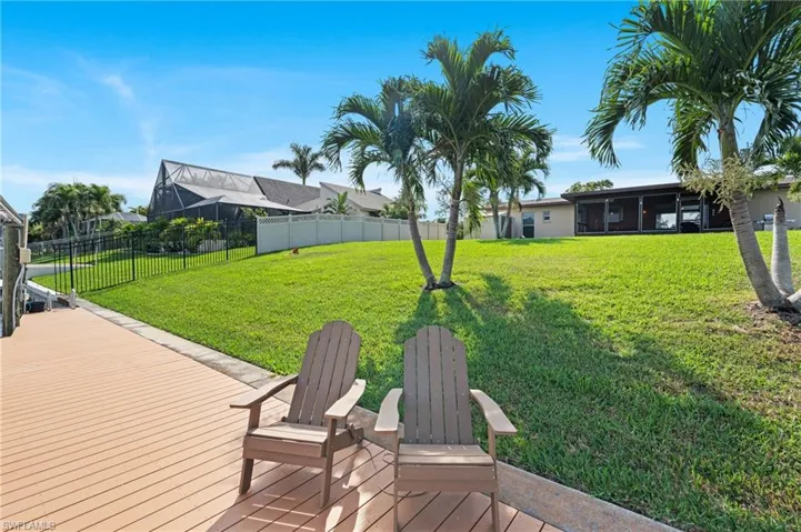View of yard with a wooden deck