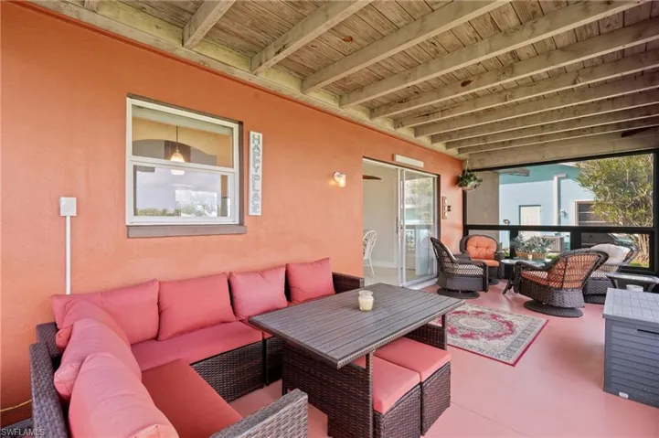 View of patio with an outdoor hangout area