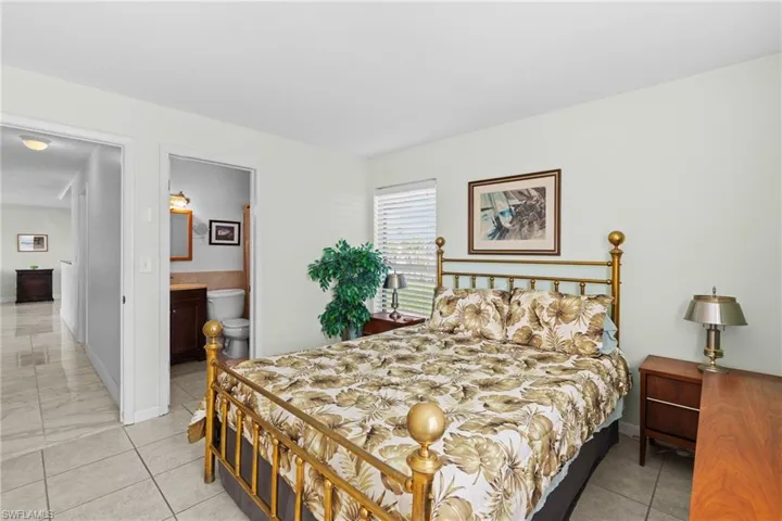Bedroom featuring ensuite bath