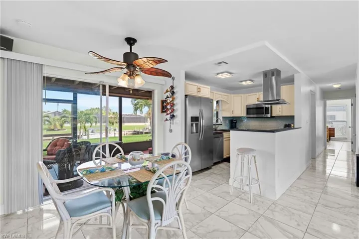 Dining area with sink and ceiling fan