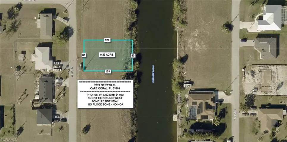 Aerial view of property and surrounding area featuring property boundaries highlighted and a large body of water