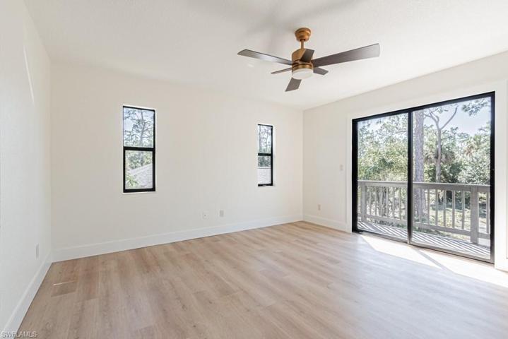 Master bedroom w/ sliders opening to loft area