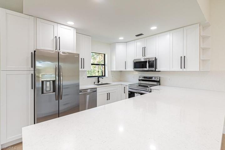 Beautiful shaker cabinets, stainless steel appliances and quartz countertops w/backsplash