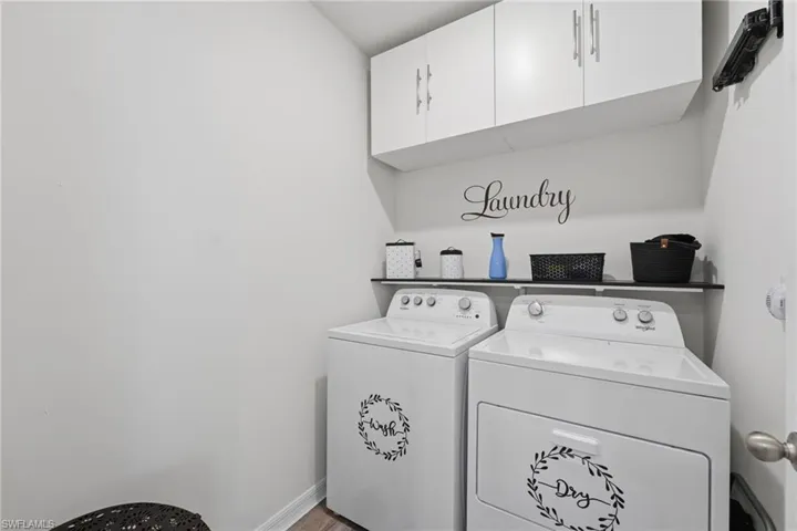 Laundry room with additional cabinetry.