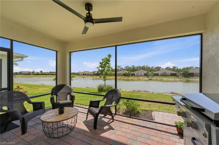Covered lanai with amazing lake and water feature views!