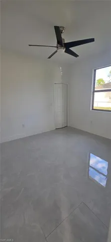 Unfurnished room with finished concrete floors