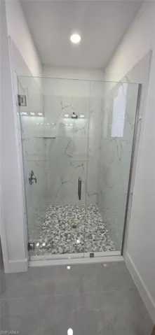 Spare room with concrete floors and ceiling fan