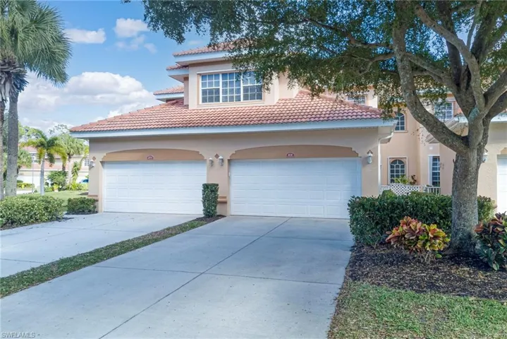 Mediterranean / spanish home featuring a garage, stucco siding, driveway, and a tile roof