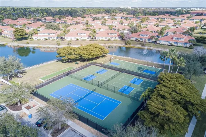Aerial view of property and surrounding area featuring a large body of water