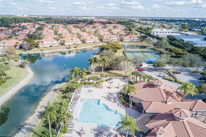 View of property location featuring a nearby body of water and a pool area