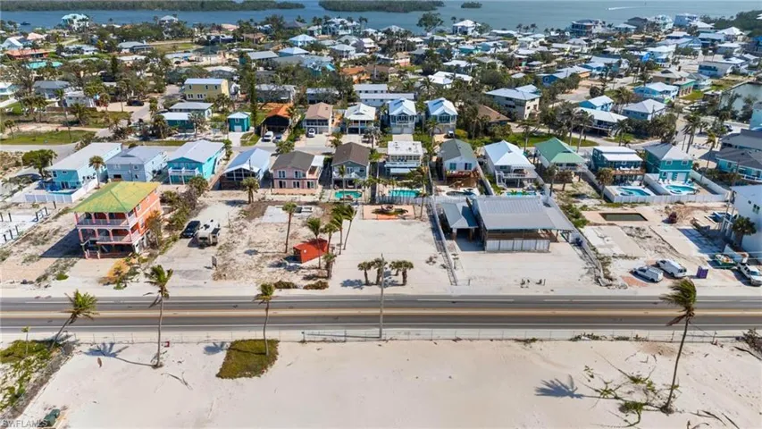 VIRTUALLY ENHANCED Aerial view with a residential view and a water view