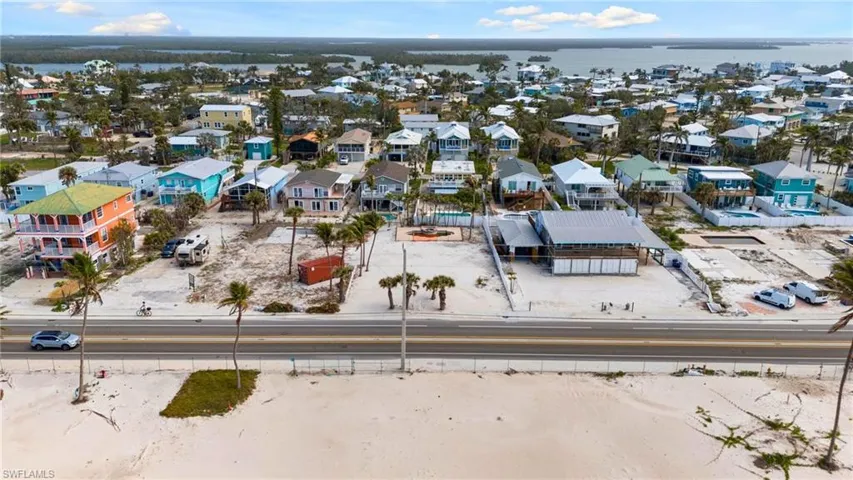 VIRTUALLY ENHANCED Aerial view with a water view and a residential view