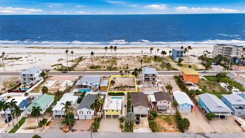 VIRTUALLY ENHANCED - Vacant lot with mature palm trees