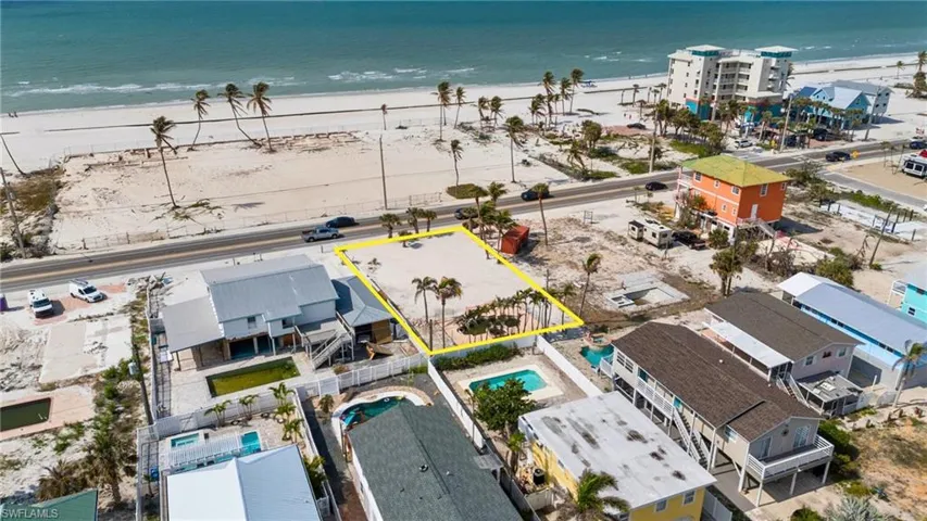 Bird's eye view with a VIRTUALLY ENHANCED beach view and a water view