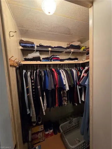 One of two walk-in closets in the Primary bedroom