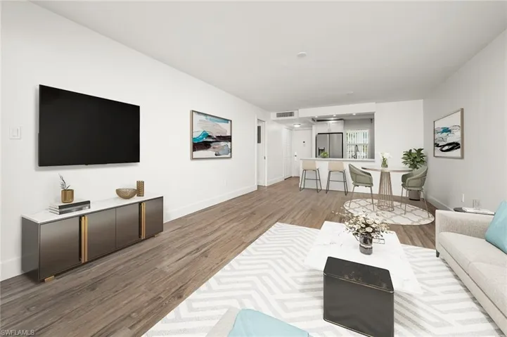 Living room with hardwood / wood-style flooring