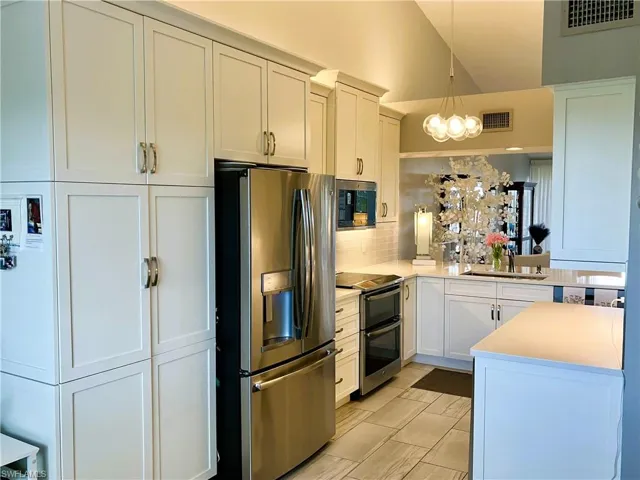 Completely updated with double oven, roll out shelves, wine fridge, under & over cabinet lighting & more