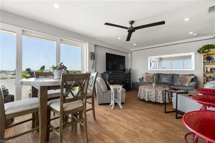 Living room with plenty of natural light and ceiling fan
