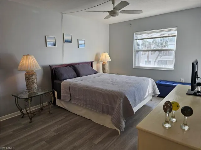 Bedroom with wood finished floors and a ceiling fan
