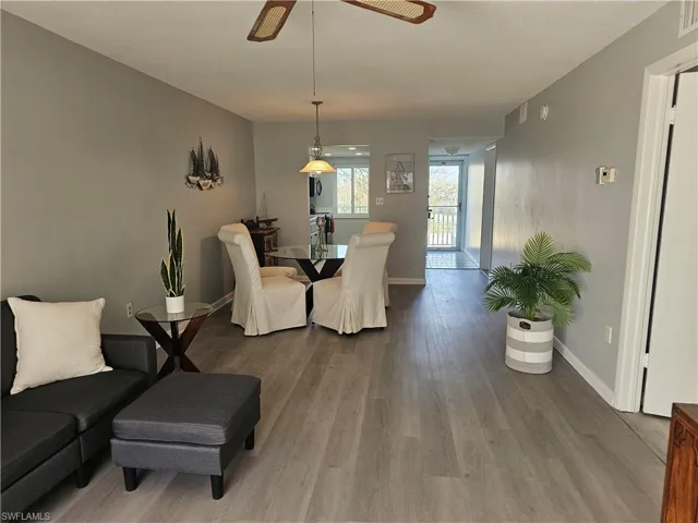 Dining space featuring wood finished floors and a ceiling fan