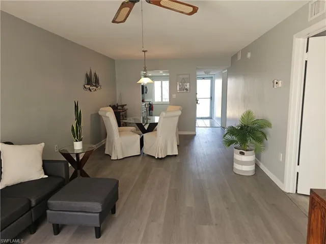 Dining room featuring wood finished floors and a ceiling fan