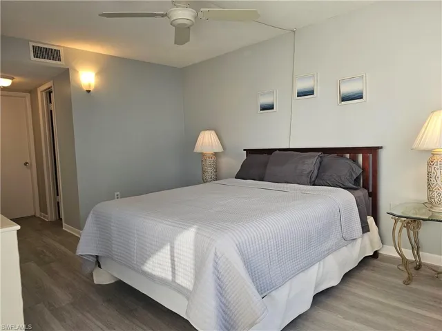 Bedroom with wood finished floors and a ceiling fan