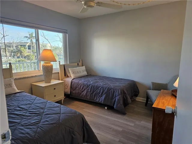 Bedroom featuring wood finished floors and ceiling fan