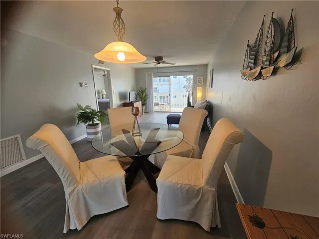 Dining room featuring wood finished floors and ceiling fan