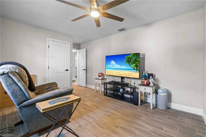 Living room featuring ceiling fan