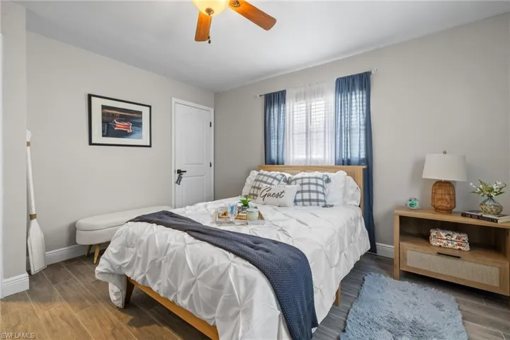 Bedroom featuring hardwood / wood-style flooring and ceiling fan