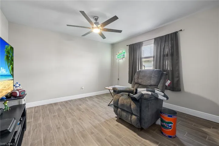 Sitting room featuring ceiling fan