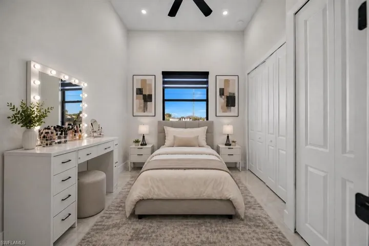 Bright interior space featuring high ceilings, recessed lighting, and a ceiling fan