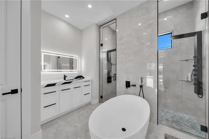 Modern bathroom featuring a freestanding oval soaking tub