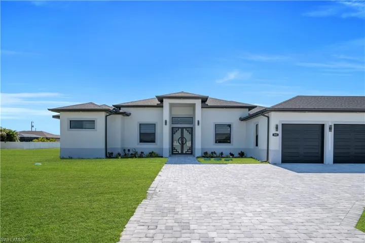 Contemporary single-story residence with a light-colored stucco exterior