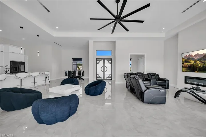 Expansive interior space featuring light-toned flooring and high ceilings