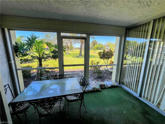 Sunroom with outdoor dining space