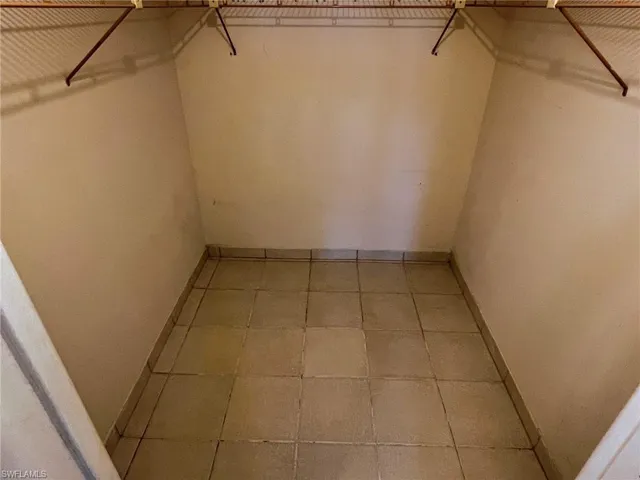 Spacious closet with tile patterned flooring