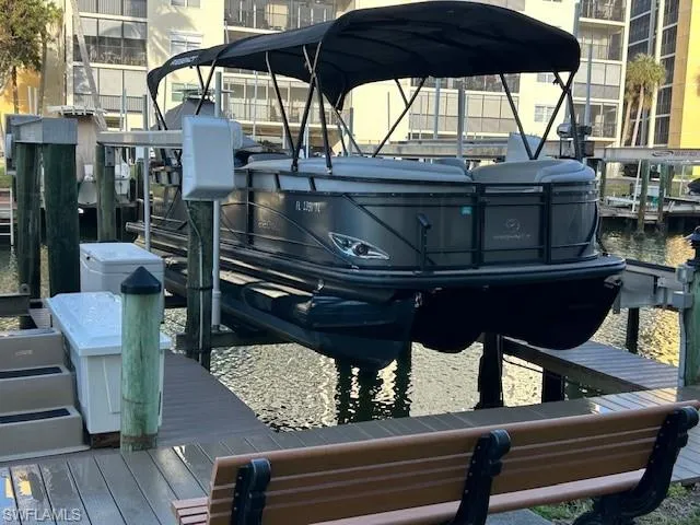 View of dock featuring boat lift