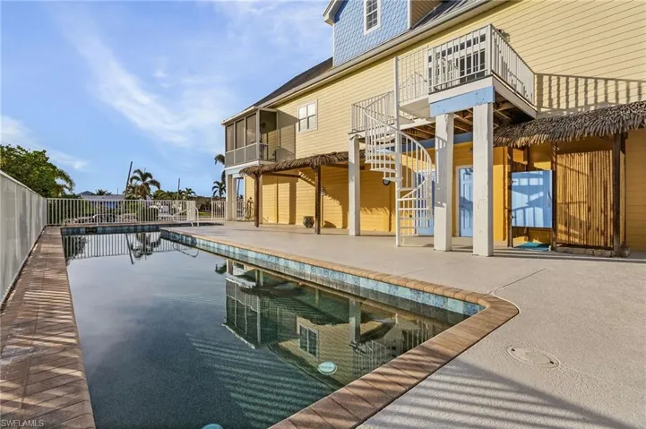 South facing 50' lap pool x 10' lap pool with outdoor shower and covered tiki area to relax.